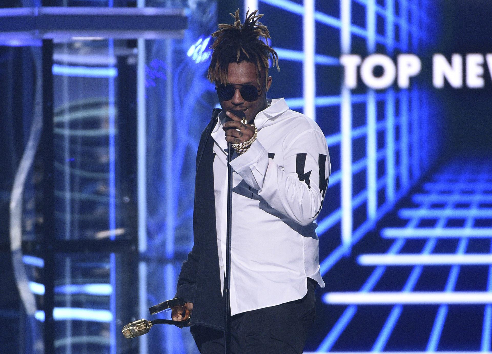 In this May 1, 2019 file photo, Juice WRLD accepts the award for top new artist at the Billboard Music Awards at the MGM Grand Garden Arena in Las Vegas. (Photo by Chris Pizzello / Invision/AP, File)