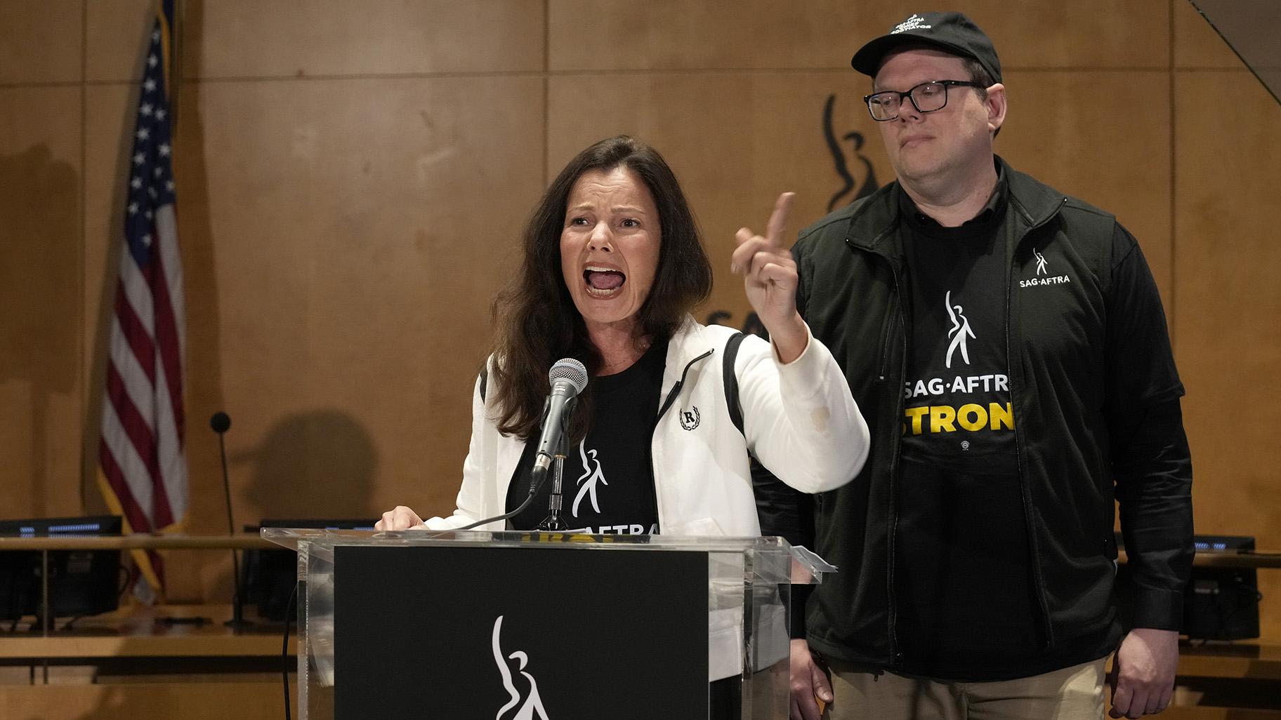 SAG-AFTRA president Fran Drescher, left, and SAG-AFTRA National Executive Director and Chief Negotiator Duncan Crabtree-Ireland speak during a press conference announcing a strike by The Screen Actors Guild-American Federation of Television and Radio Artists on Thursday, July, 13, 2023, in Los Angeles. (AP Photo / Chris Pizzello)