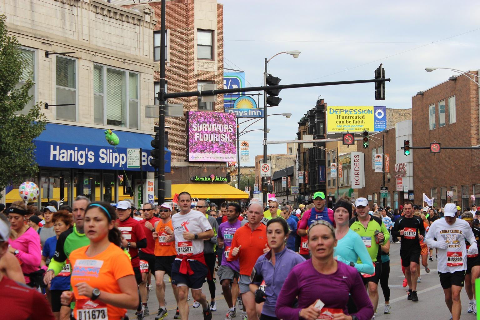 Runners participate in the 2012 Chicago Marathon near the intersection of Clark Street and Diversey Parkway. (Benjamin Lipsman / Flickr)