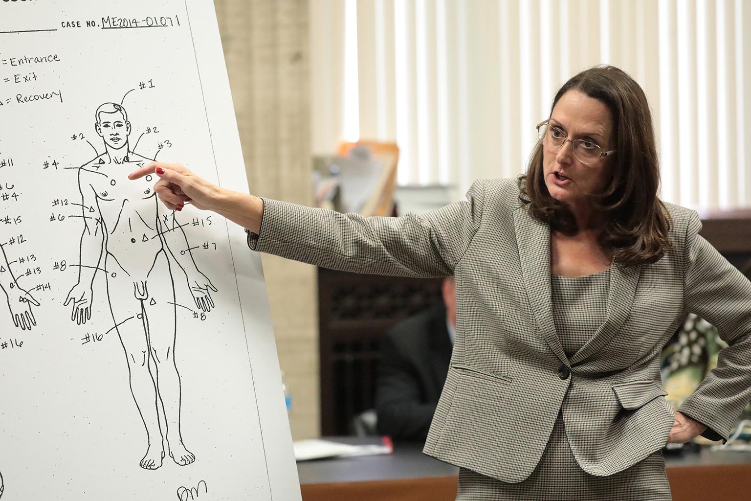 Prosecutor Jody Gleason points to a medical examiner's diagram showing the wounds to Laquan McDonald on Monday, Sept. 24, 2018. (Antonio Perez / Chicago Tribune / Pool)