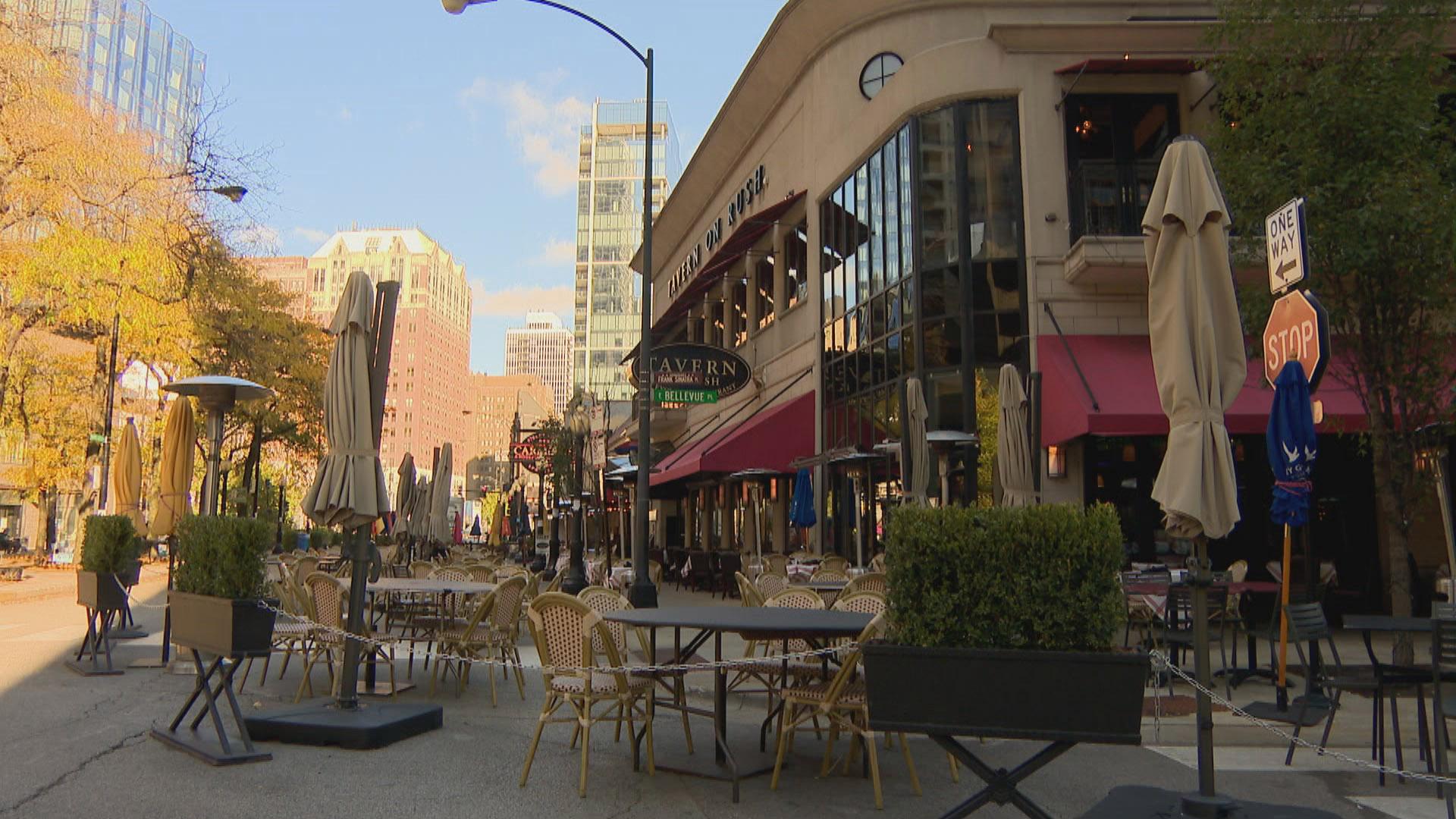 Outdoor dining tables line Rush Street in Chicago as state-imposed restrictions suspending indoor dining and drinking take effect Friday, Oct. 30, 2020. (WTTW News)