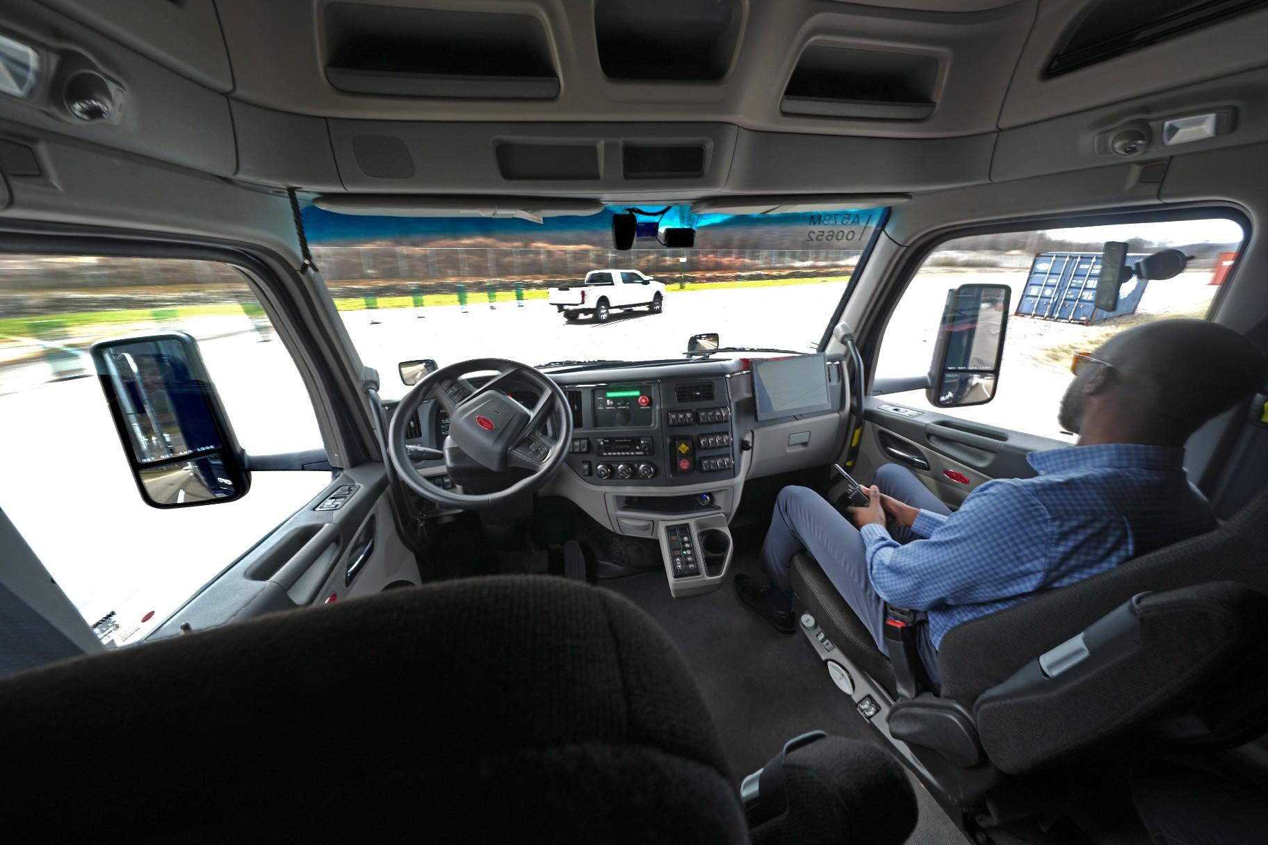 The interior of the cab of a self driving truck is shown as the truck maneuvers around a test track in Pittsburgh, Thursday, March 14, 2024. The truck is owned by Pittsburgh-based Aurora Innovation Inc. Late this year, Aurora plans to start hauling freight on Interstate 45 between the Dallas and Houston areas with 20 driverless trucks. (AP Photo / Gene J. Puskar)