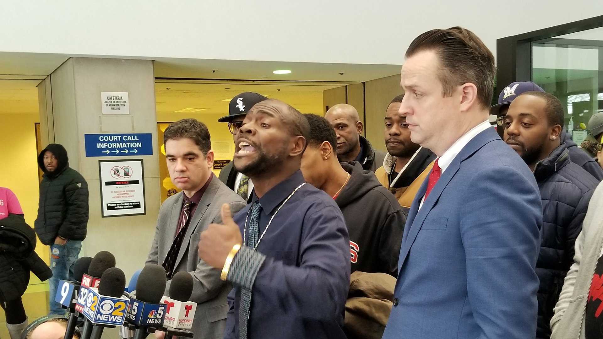 Kim Wilbourn, center, speaks to media following his exoneration Monday, Feb. 11, 2019. (Matt Masterson / Chicago Tonight)