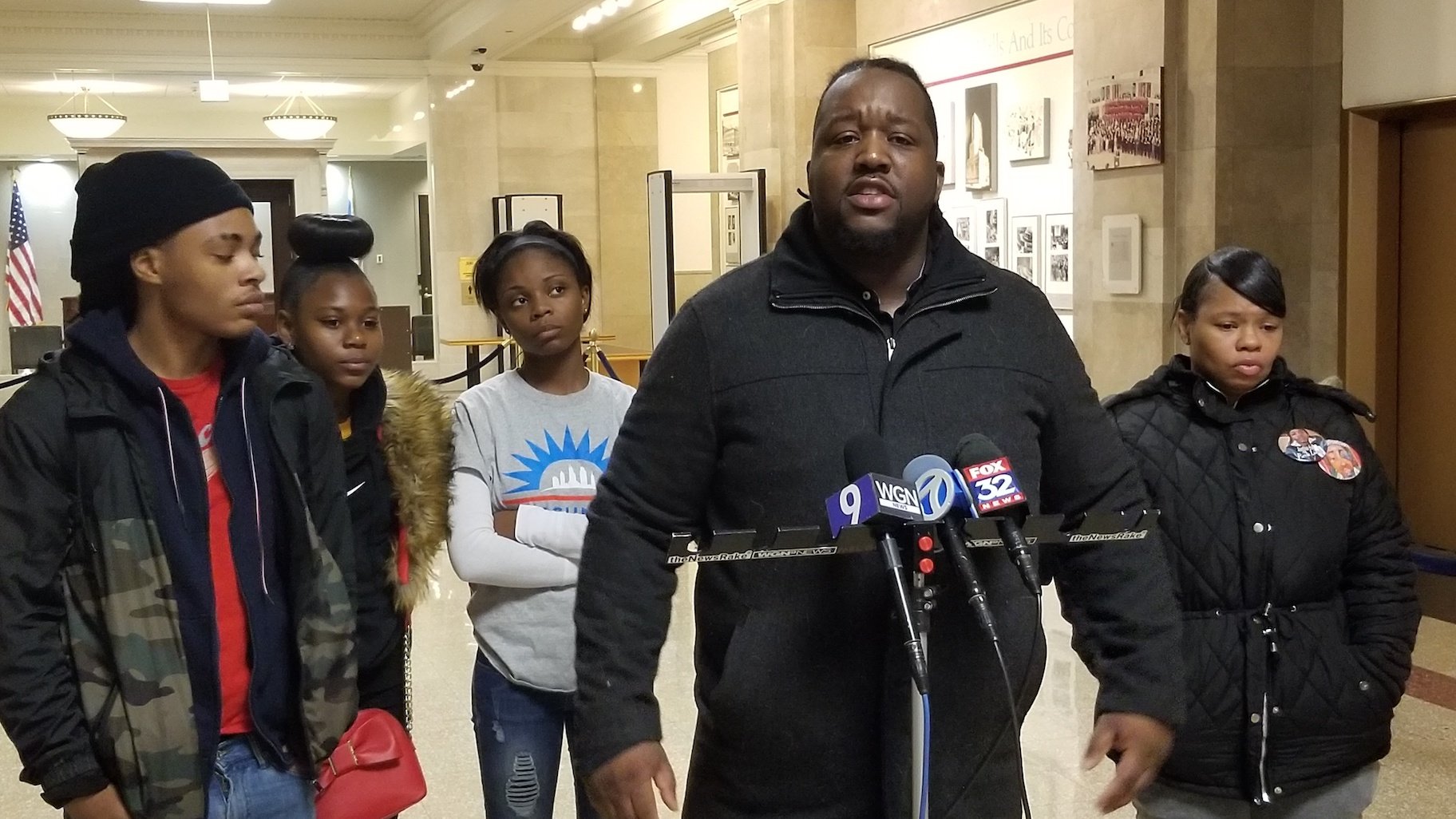 Martinez Sutton, center, speaks at City Hall on Thursday, Nov. 14, 2019 about the killing of his sister Rekia Boyd by former Chicago police Detective Dante Servin in 2012. (Matt Masterson / WTTW News)