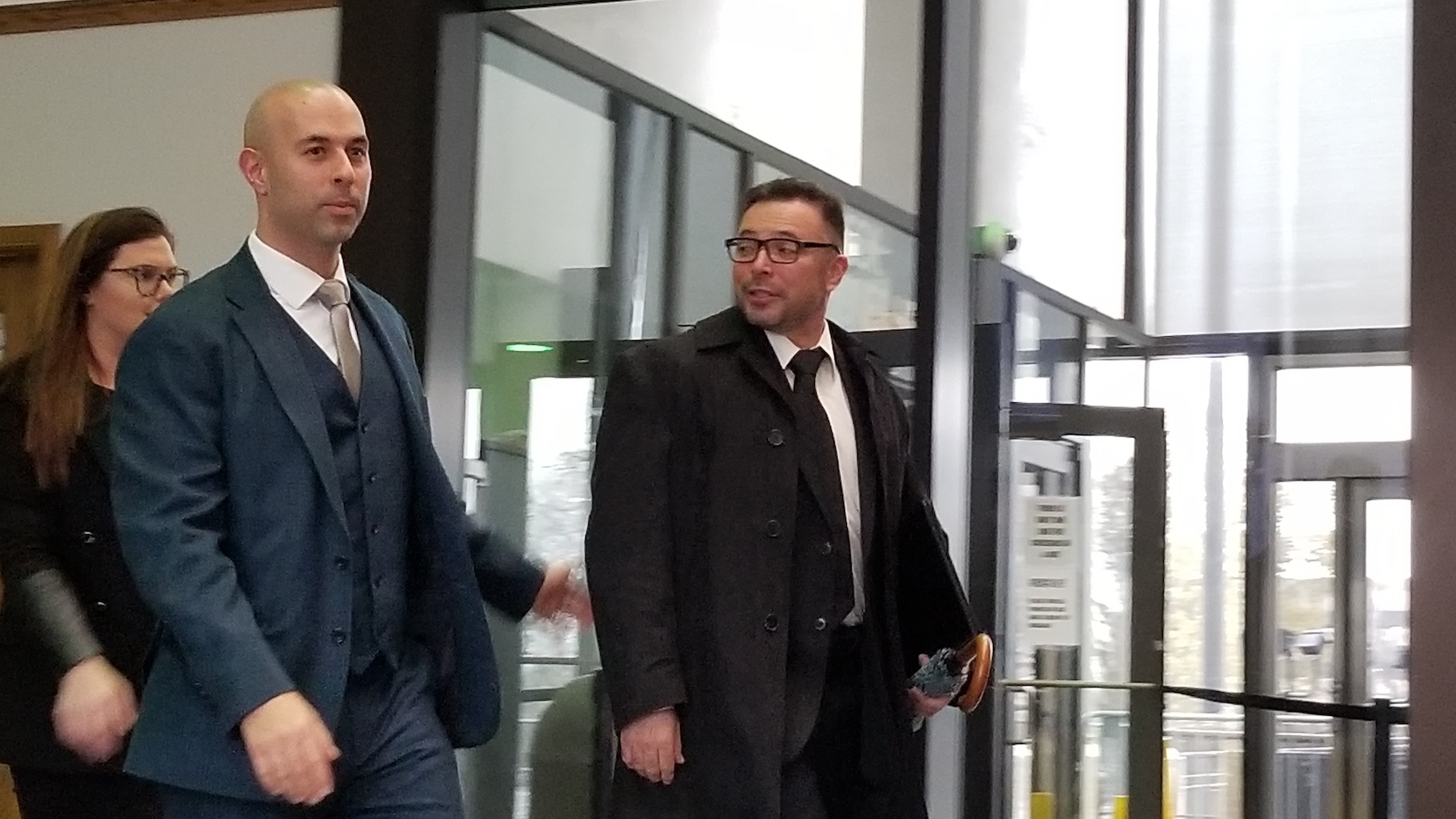 Former Chicago police Detective Dante Servin, right, exits the Leighton Criminal Court Building following his expungement hearing Tuesday, Nov. 19, 2019. (Matt Masterson / WTTW News)