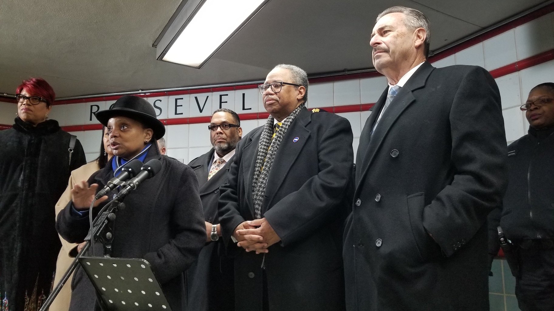 Chicago Mayor Lori Lightfoot, CTA President Dorval R. Carter Jr., center, and CPD interim Supt. Charlie Beck, right, address the media Friday morning inside the Roosevelt Red Line CTA station. (Matt Masterson / WTTW News)