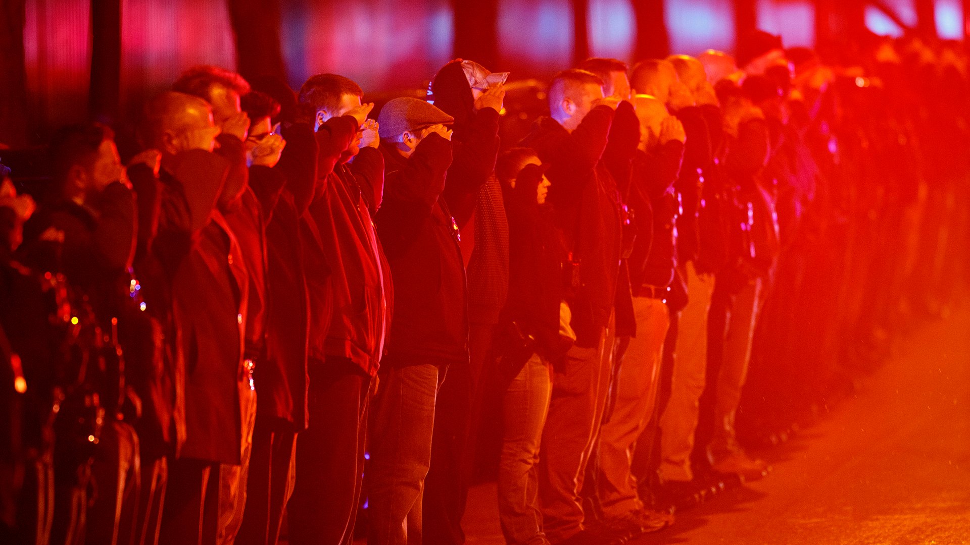 Police salute as an ambulance arrives at the medical examiner’s office carrying the body of Chicago Police Department Officer Samuel Jimenez, who was killed during a shooting at Mercy Hospital earlier on Monday, Nov. 19, 2018. (Armando L. Sanchez / Chicago Tribune via AP)