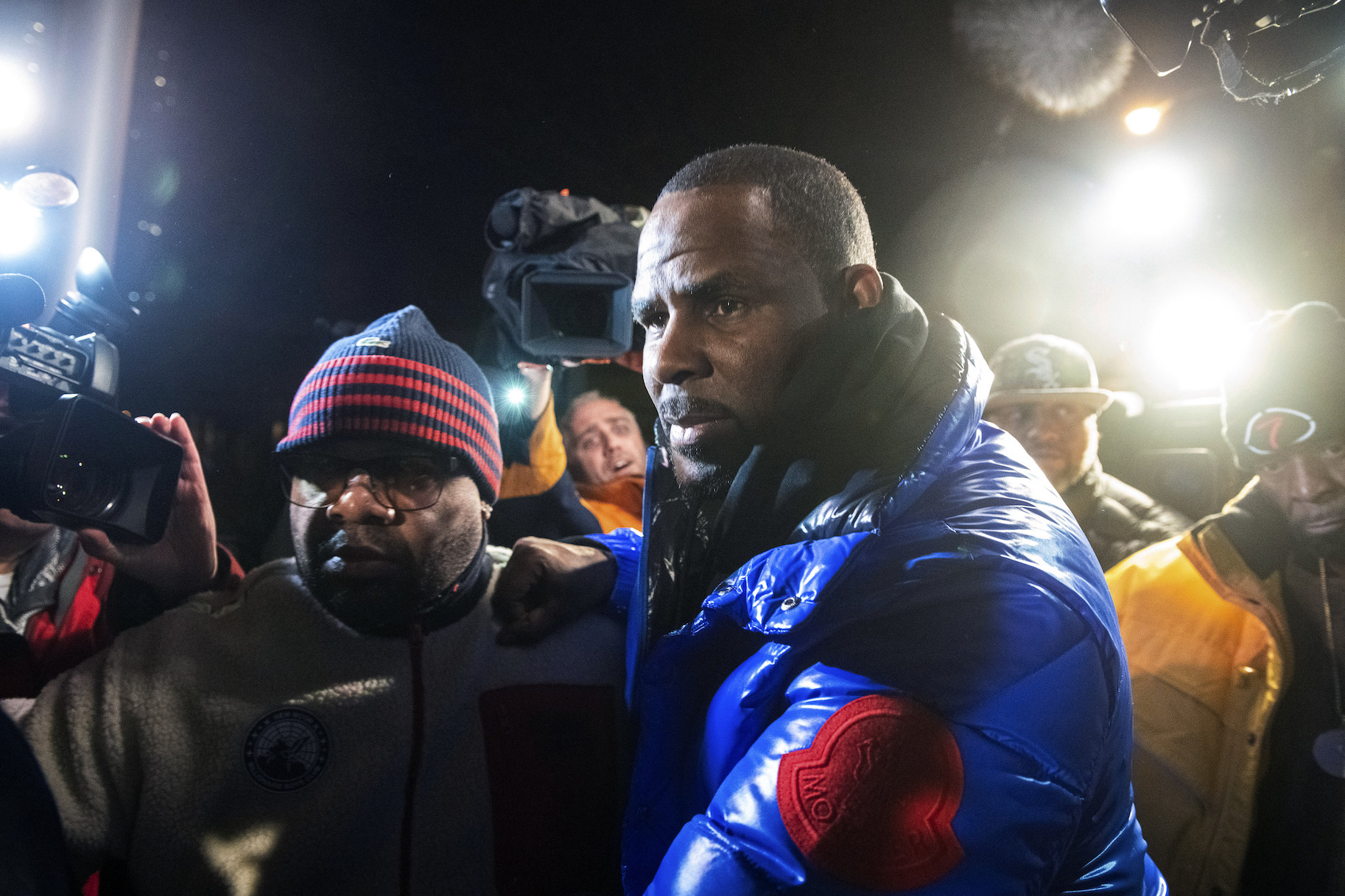 R. Kelly surrenders to authorities at Chicago First District police station on Friday, Feb. 22, 2019. (Tyler LaRiviere / Chicago Sun-Times via AP)