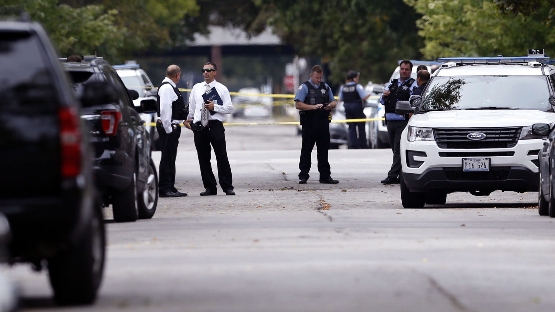 A police officer was shot while serving a warrant on Chicago’s South Side on Saturday, Sept. 21, 2019. The man suspected of shooting the officer and of being the cyclist who shot a woman in broad daylight near downtown days earlier has been captured, police said. (Kevin Tanaka / Chicago Sun-Times via AP)