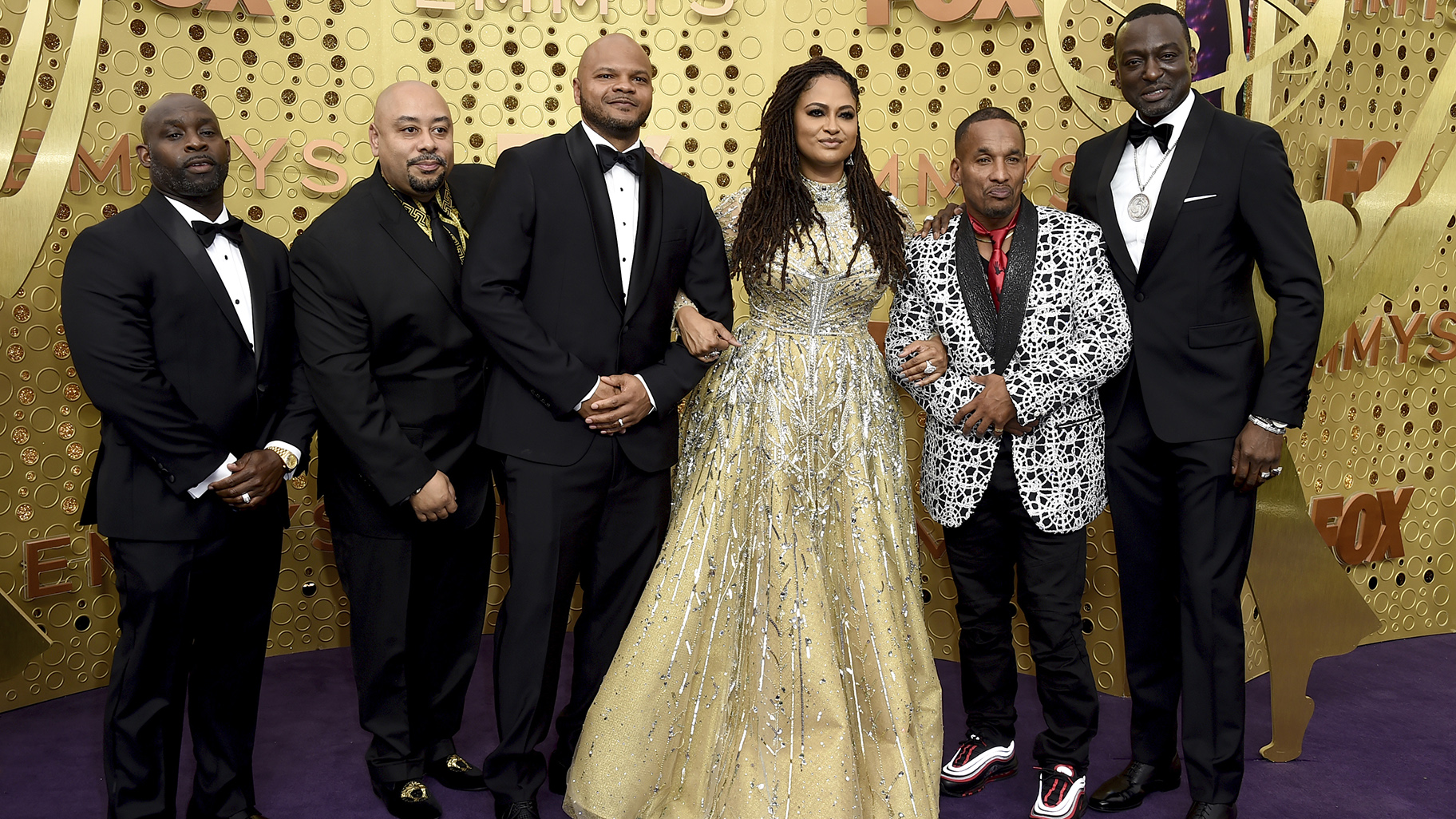 Ava DuVernay, center, is joined by Antron McCray, Raymond Santana, Kevin Richardson, Korey Wise and Yusef Salaam, of the Central Park Five, during arrivals of the 71st Primetime Emmy Awards on Sunday, Sept. 22, 2019, at the Microsoft Theater in Los Angeles. (Photo by Jordan Strauss/Invision/AP)