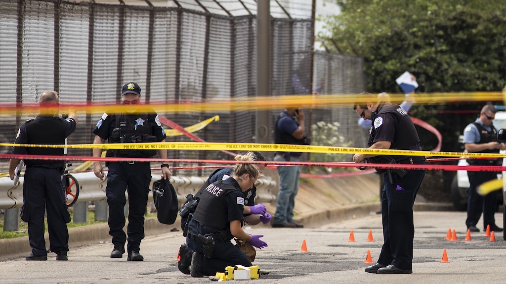 Chicago Police investigate at the 25th District station on the Northwest Side, after several officers were shot outside the station, Thursday, July 30, 2020. (Ashlee Rezin Garcia/Chicago Sun-Times)