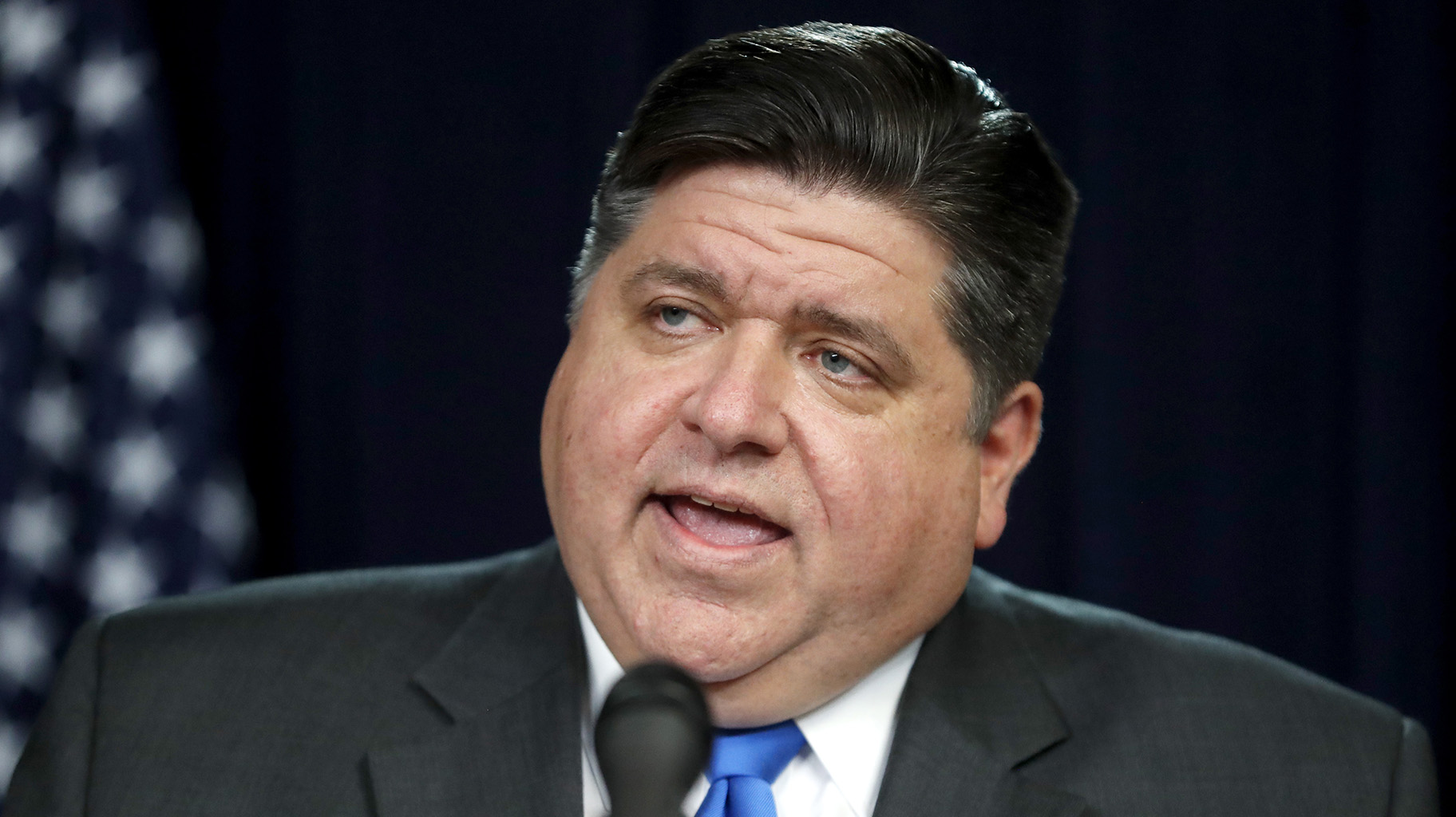 Illinois Gov. J.B. Pritzker announces a shelter-in-place rule to combat the spread of the Covid-19 virus, during a news conference Friday, March 20, 2020, in Chicago. (AP Photo / Charles Rex Arbogast)
