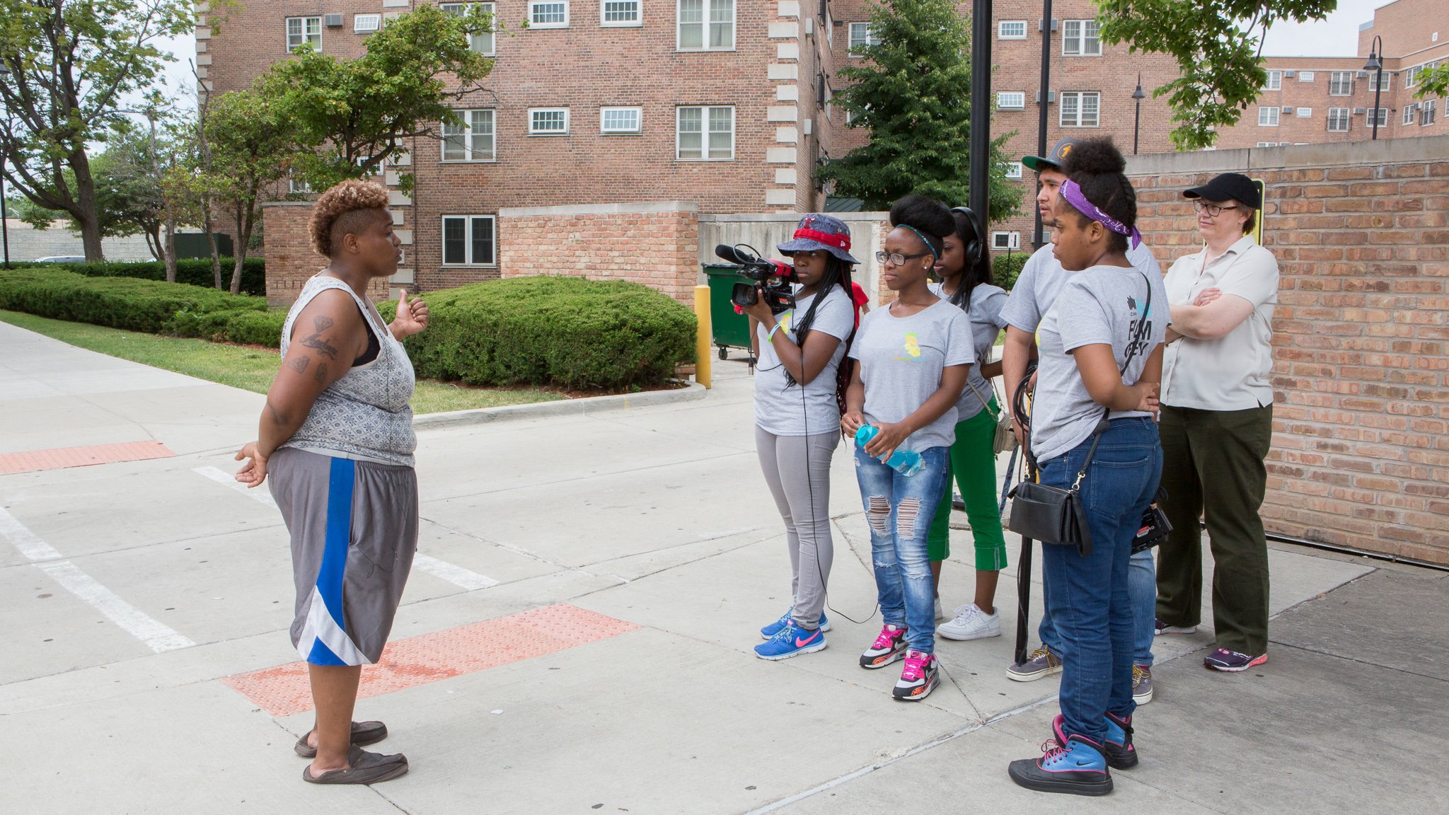 Young filmmakers work on a documentary about teen pregnancy at Dearborn Homes, a public housing community in Bronzeville. The film was one of four produced this summer as part of a new program between the Chicago Housing Authority and DePaul University. (Courtesy of Liliane Calfee)