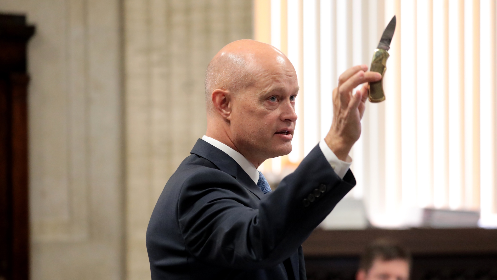 During opening statements on Monday, Sept. 17, 2018, special prosecutor Joseph McMahon holds the 3-inch blade Laquan McDonald carried the night we was killed. (Antonio Perez / Chicago Tribune / Pool)