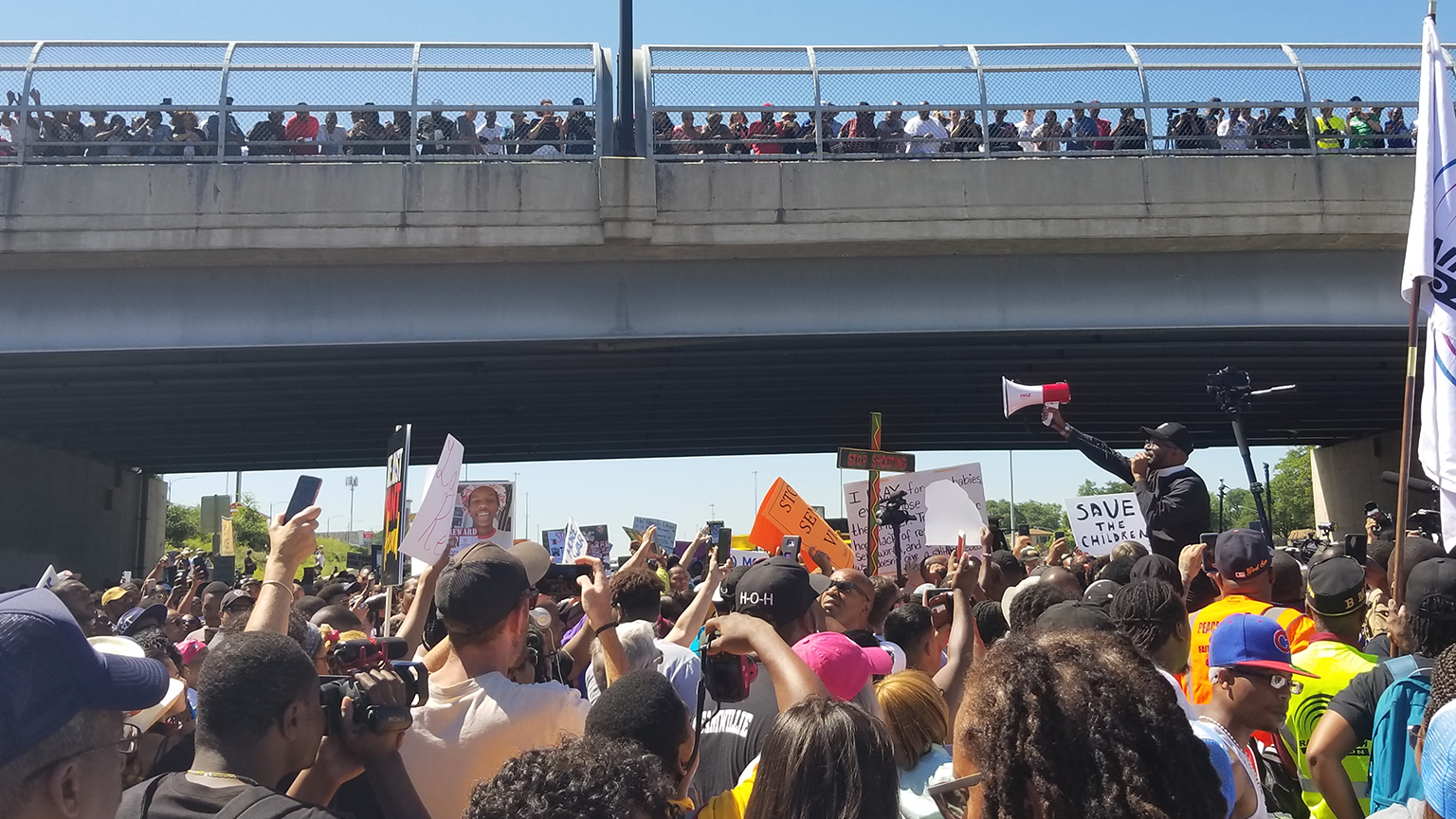 Protesters on the Dan Ryan Expressway on July 7, 2018. (Matt Masterson / Chicago Tonight)