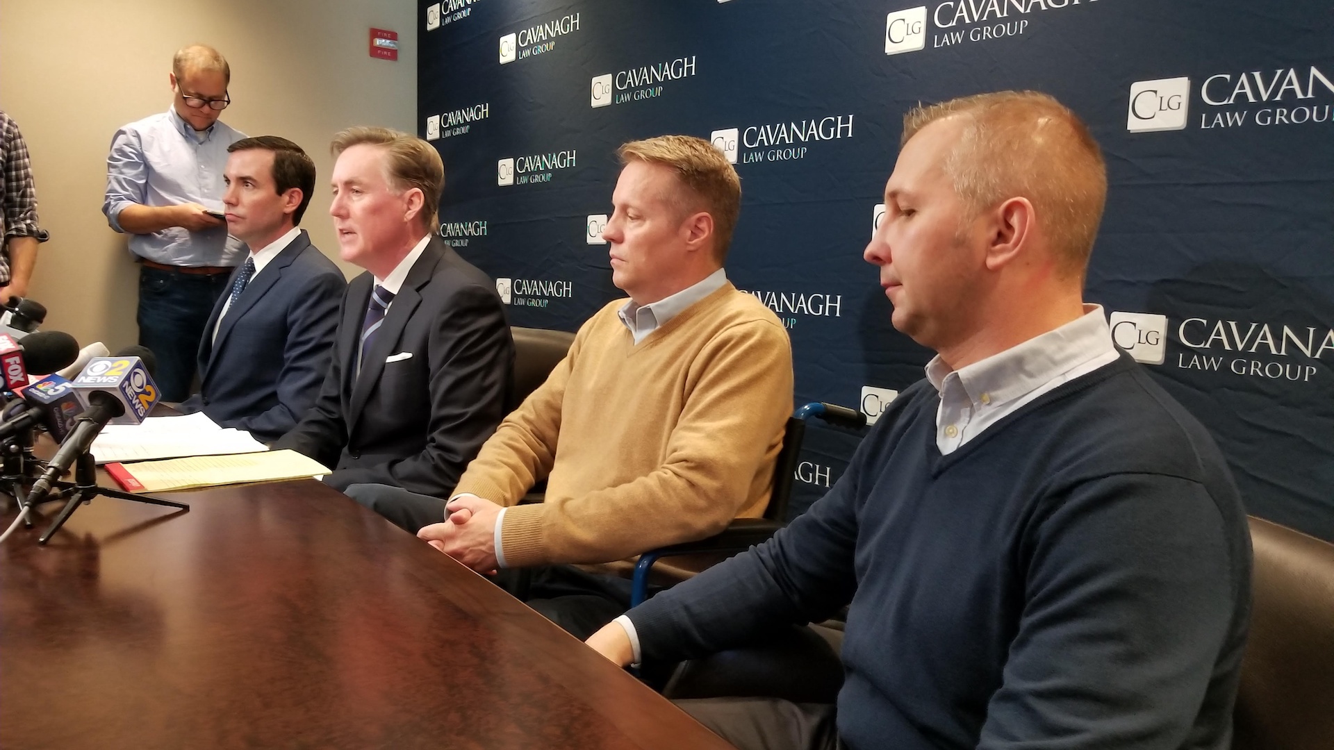 From right: Tomasz Stacha, John Sherwood and attorney Tim Cavanagh discuss their lawsuit. (Matt Masterson / Chicago Tonight)