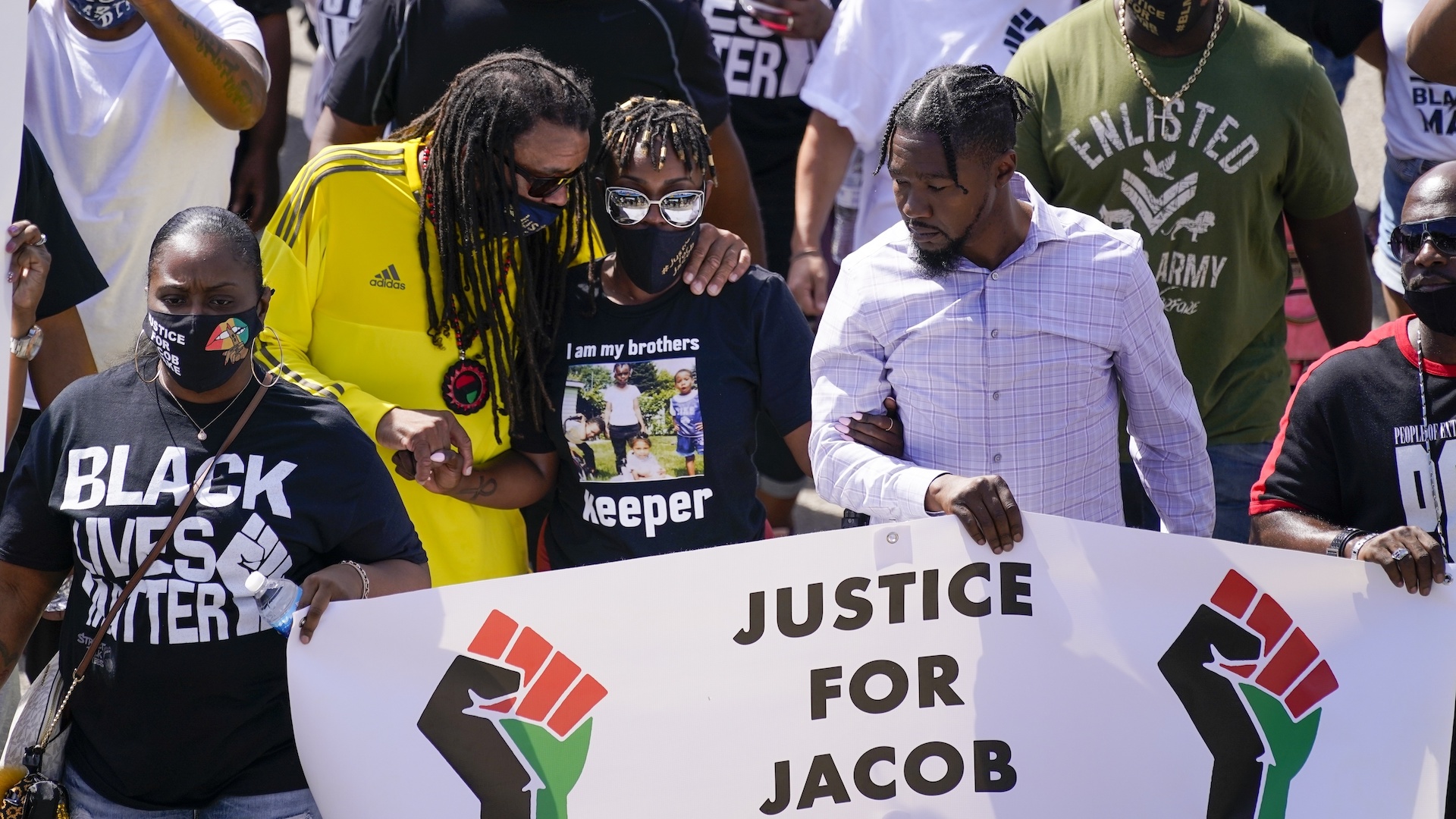 In this Aug. 29, 2020, file photo, Jacob Blake's sister Letetra Widman, center, and uncle Justin Blake, left, march at a rally for Jacob Blake Saturday, Aug. 29, 2020, in Kenosha, Wis. (AP Photo/Morry Gash, File)