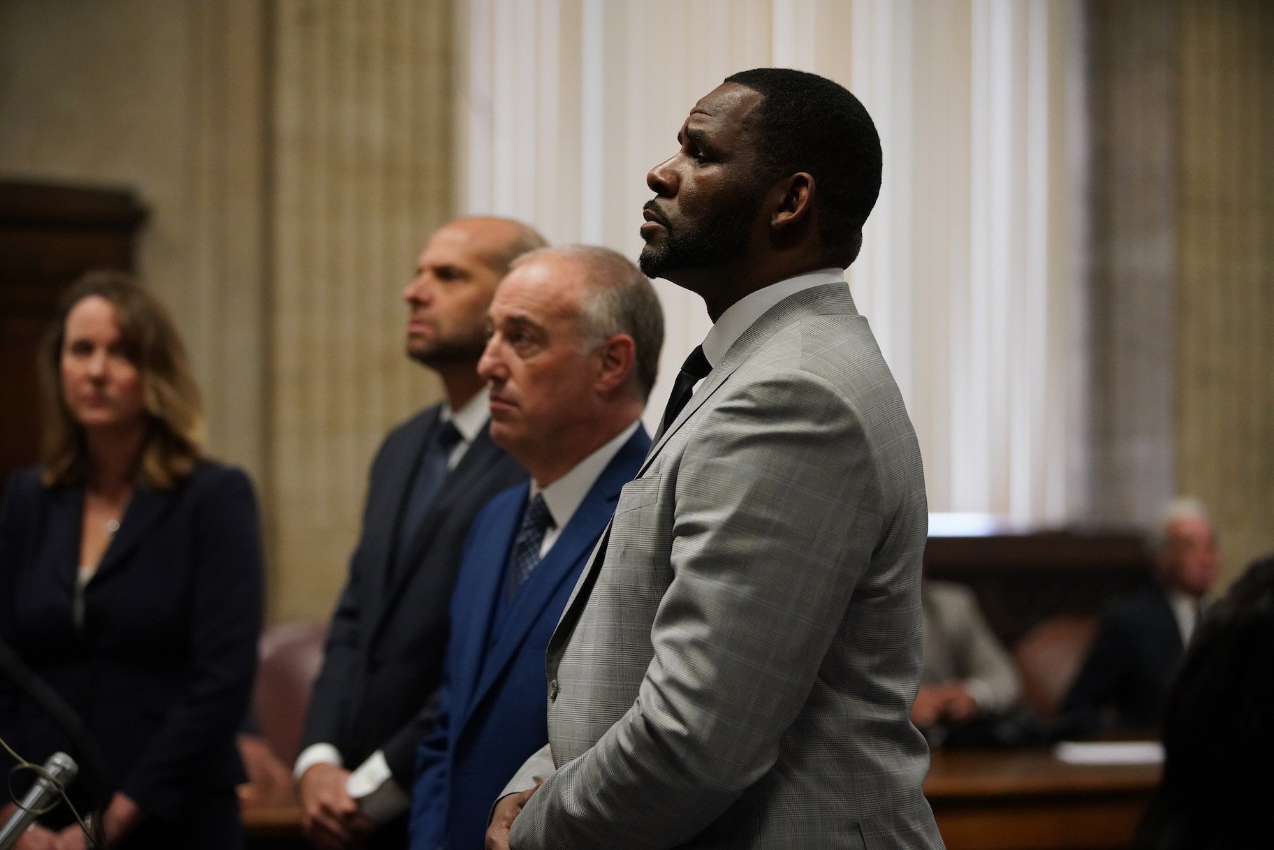 R. Kelly pleaded not guilty to a new indictment before Judge Lawrence Flood with his attorney Steve Greenberg at Leighton Criminal Court Building in Chicago, Thursday, June 6, 2019 (E. Jason Wambsgans/Chicago Tribune/Pool)