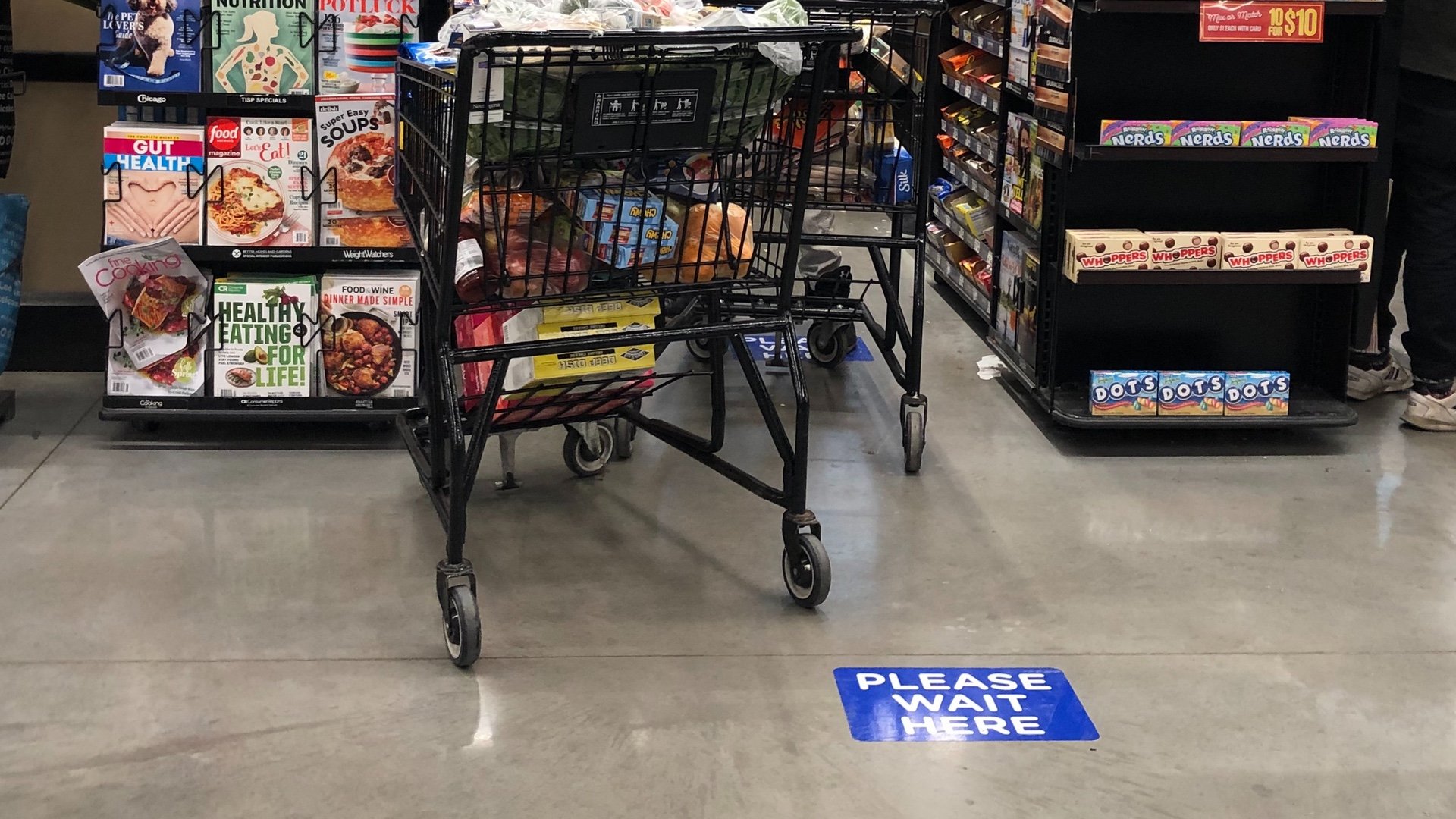 Best practices at grocery stores include social distancing markers in checkout lines. (Patty Wetli / WTTW)