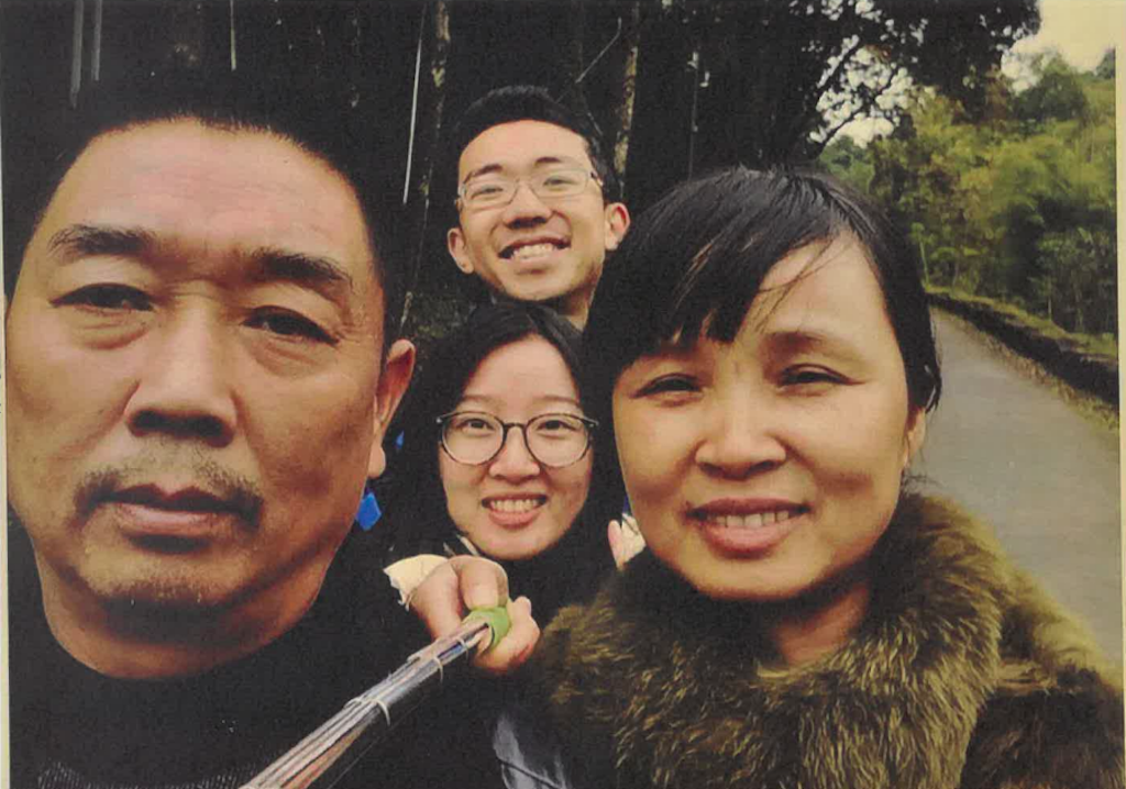 Yingying Zhang, center, takes a photo with her father Ronggao Zhang, left, mother Lifeng Ye and fiance Xiaolin Hou. (U.S. Attorney's Office)