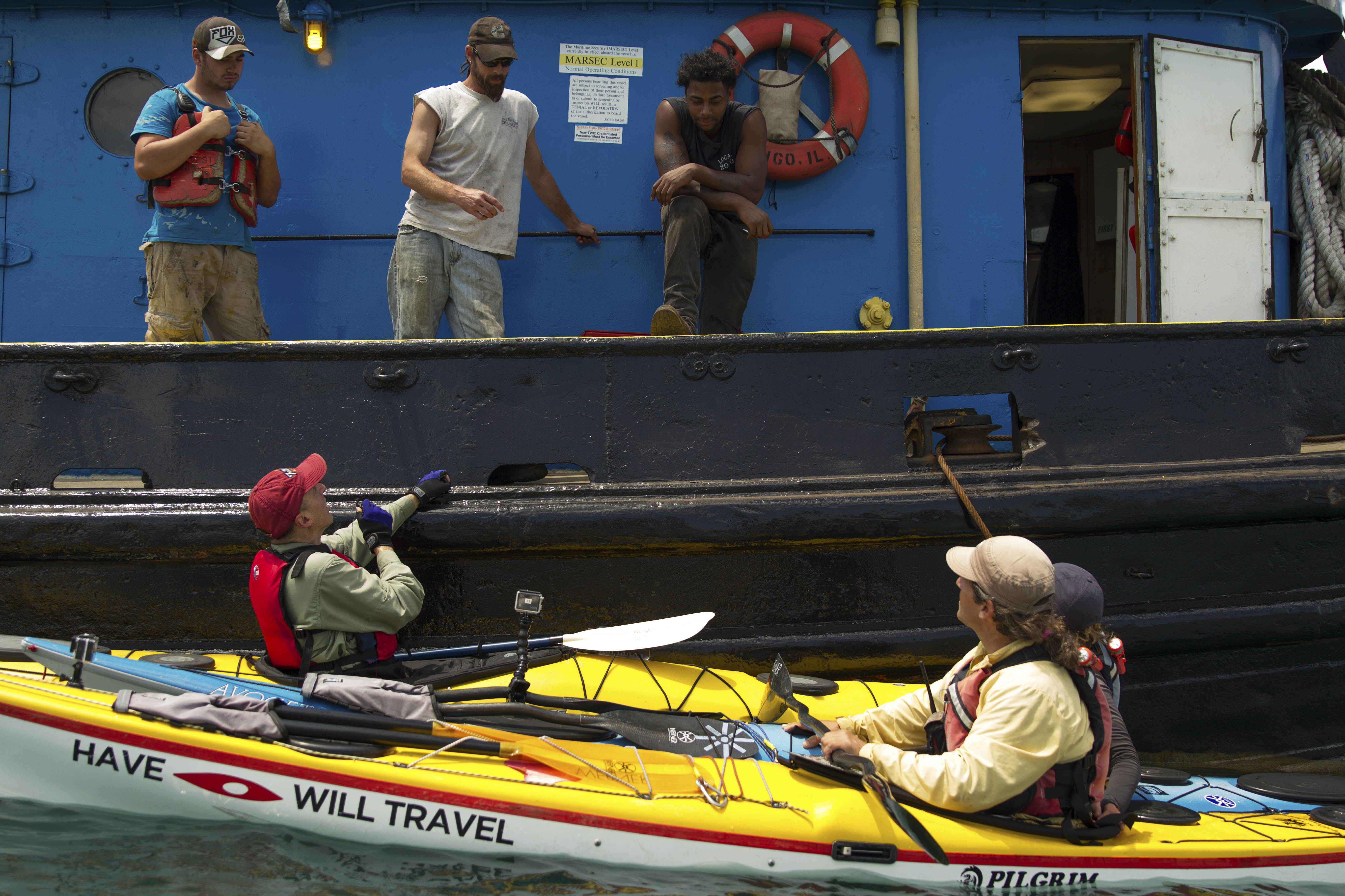 Chatting with a tugboat crew in the Calumet River. (Luke Brodarick / Chicago Tonight)
