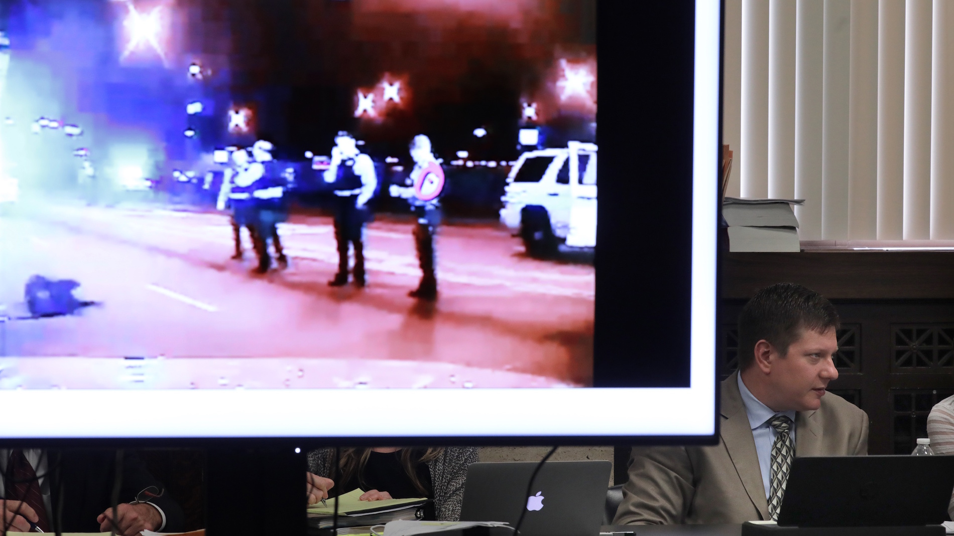 Chicago police Officer Jason Van Dyke listens to court proceedings on Tuesday, Sept. 18, 2018 as an image of Laquan McDonald’s body lying on the street is displayed. (Antonio Perez / Chicago Tribune / Pool)