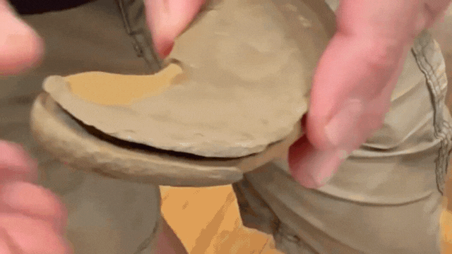 Rich Holm demonstrates how concretions open. (Patty Wetli / WTTW News)
