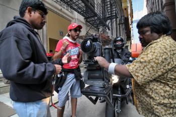 During a lunch break, the crew runs tests with the motorcycle camera.