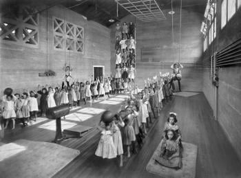 A pass-the-ball relay in a Chicago park field house, 1905. Chicago Park District archive