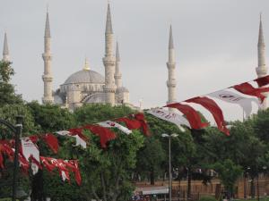 Turkish flags wave in the foreground of the Blue Mosque/Caroline Pahl
