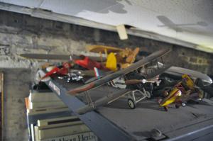 Toy airplanes litter the tops of bookshelves at Bookman's Alley; click image to view photo gallery.