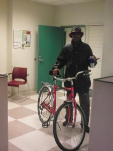 Sammie Lemon poses for a picture with the bike he received through Working Bikes.