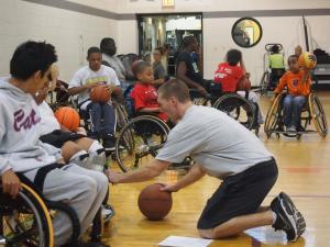 Coach Trent working with players