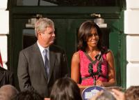 First Lady Michelle Obama and Agriculture Secretary Tom Vilsick on the White House South Lawn Monday.