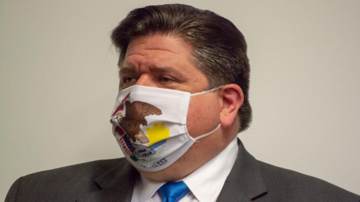 Gov. JB Pritzker wears an Illinois face mask amid the COVID-19 pandemic in 2021. (Jerry Nowicki / Capitol News Illinois) 