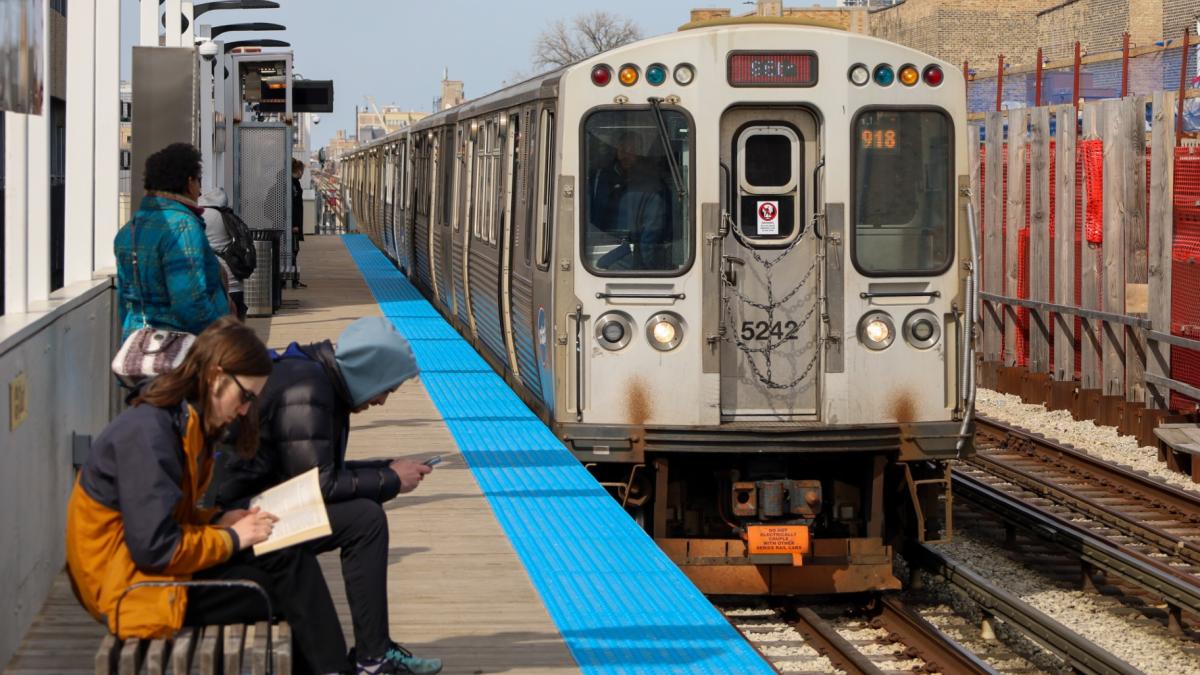 Passengers for the CTA Red Line wait for their train to arrive in 2023. (Andrew Adams / Capitol News Illinois)