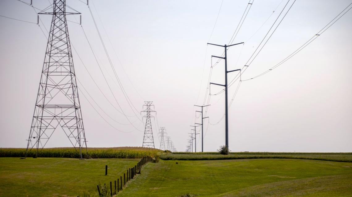 ower lines carry electricity over fields near Glasford. (Andrew Adams / Capitol News Illinois)