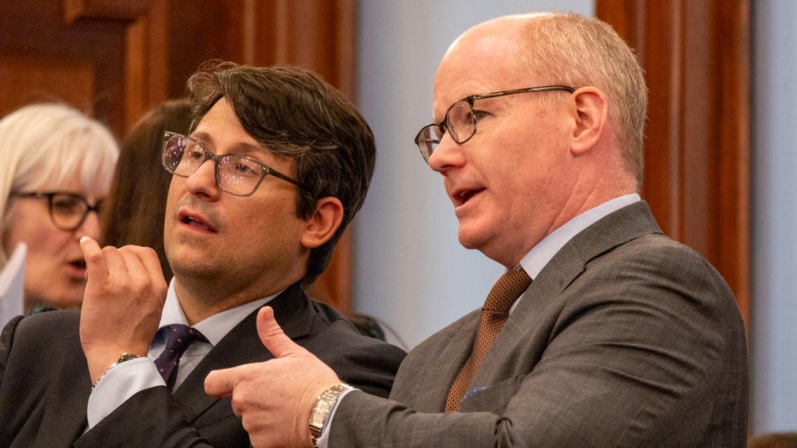 Senate President Don Harmon, D-Oak Park, right, speaks with a Senate staffer a few hours before debating a bill to reform the Prisoner Review Board on April 11, 2025. (Andrew Adams / Capitol News Illinois)