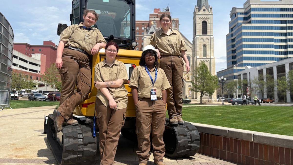 The first all-girls construction team to compete at SkillsUSA Illinois poses outside the Peoria Civic Center after their competition. From left, Aubrey Levin, Kayhl Miles, Amyla Walls and Catelin Wesley. (Maggie Dougherty / Medill Illinois News Bureau)
