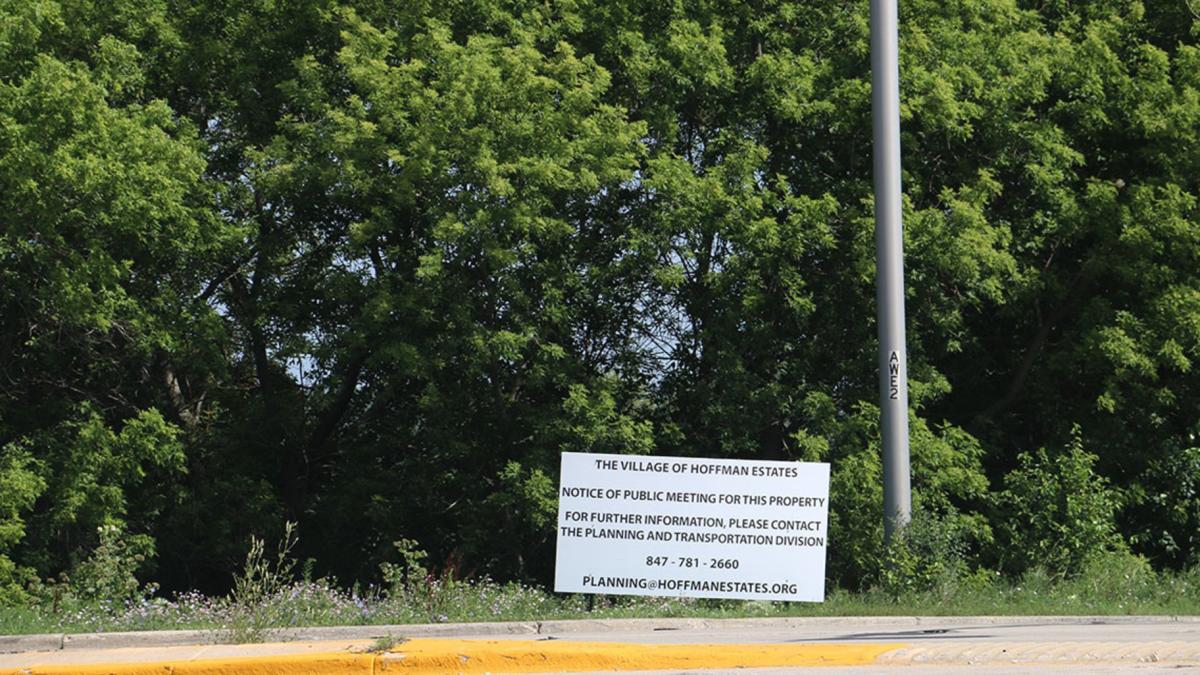 A sign provides notice for a public meeting of the Hoffman Estates Plan Commission to discuss rezoning the 186-acre property at Higgins Road and Route 59. The developer notified the village on July 1, 2026, that it would withdraw the rezoning request after community backlash. (Maggie Dougherty / Capitol News Illinois)