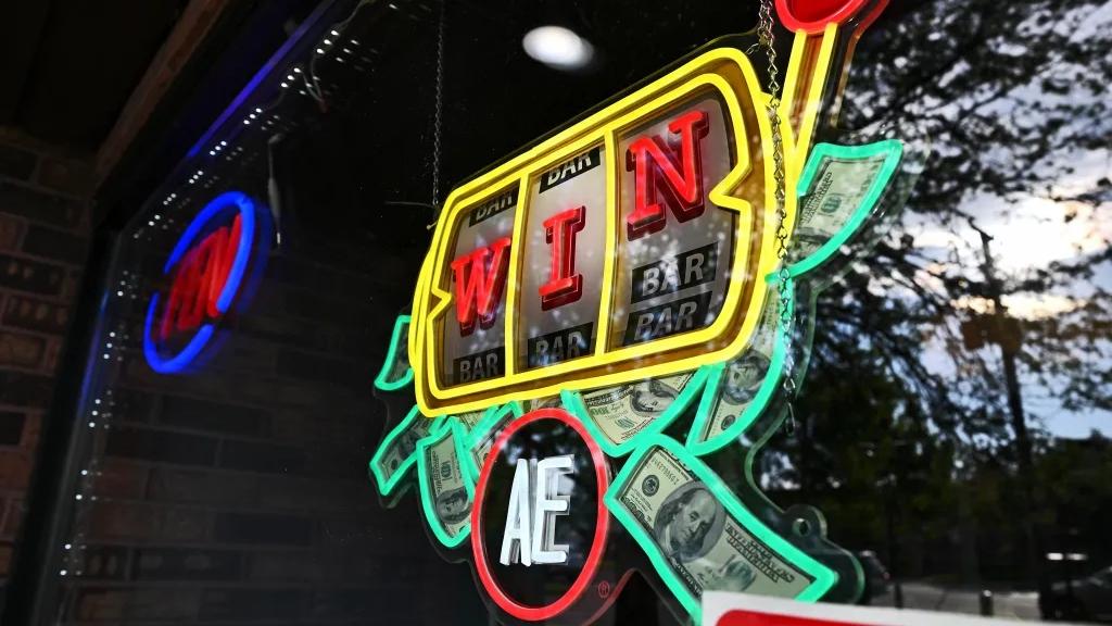 A sign advertises slot machines at a video gaming cafe in west suburban Oakbrook Terrace. (Victor Hilitski for Illinois Answers Project)