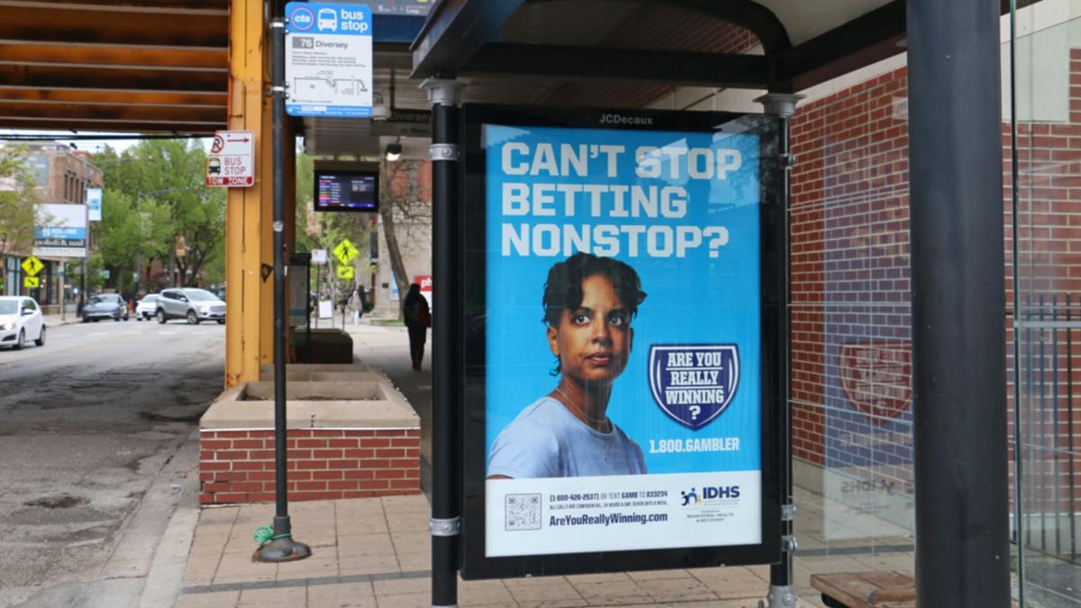 A Chicago bus stop advertises the state’s gambling addiction helpline. (Maggie Dougherty / Capitol News Illinois)