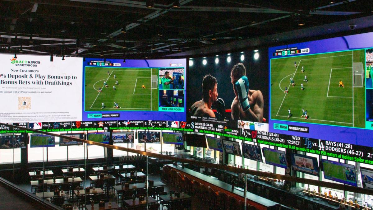 A massive 2,000-square-foot television wraps around the DraftKings Sports Bar at Wrigley Field. (Maggie Dougherty / Capitol News Illinois)