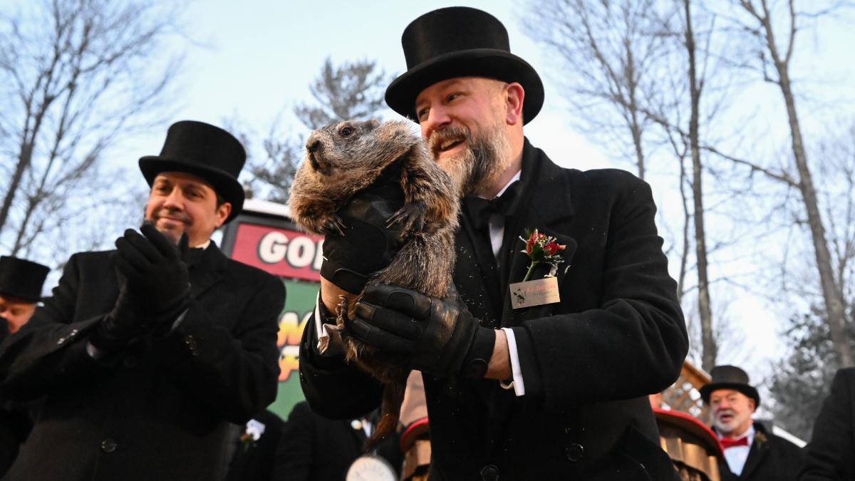 Groundhog Club handler A.J. Dereume holds Punxsutawney Phil, the weather prognosticating groundhog, during the 140th celebration of Groundhog Day on Gobbler's Knob in Punxsutawney, Pa., Monday, Feb. 2, 2026. Phil's handlers said that the groundhog has forecast six more weeks of winter. (AP Photo / Barry Reeger)