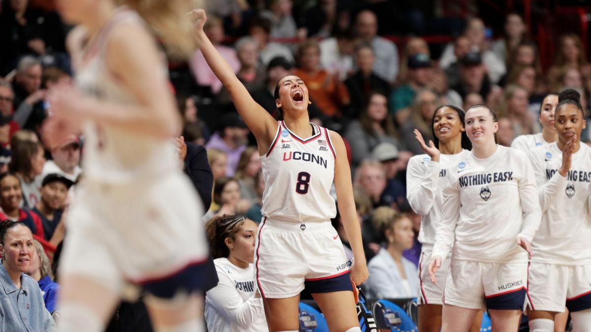 UConn center Jana El Alfy (8) and her teammates celebrate during the second half against Oklahoma in the Sweet 16 of the NCAA college basketball tournament, Saturday, March 29, 2025, in Spokane, Wash. (AP Photo / Young Kwak)