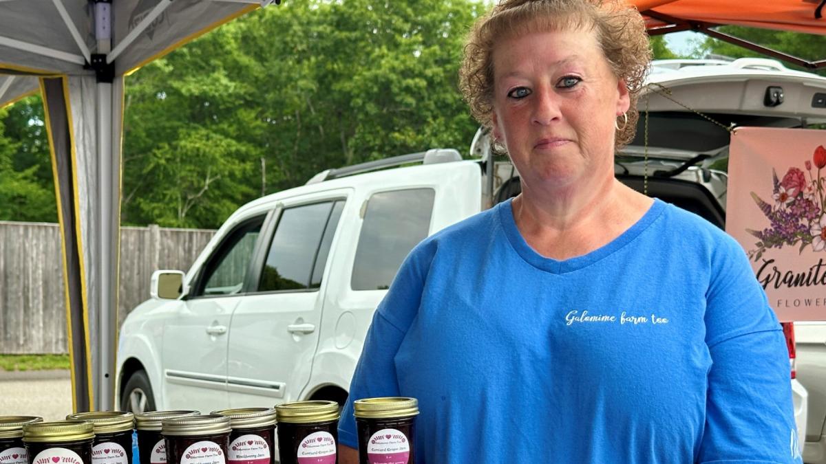 Mindy Dean poses for a photo at the farmers market in Bedford, N.H., Tuesday, June 30, 2026. (AP Photo / Holly Ramer)