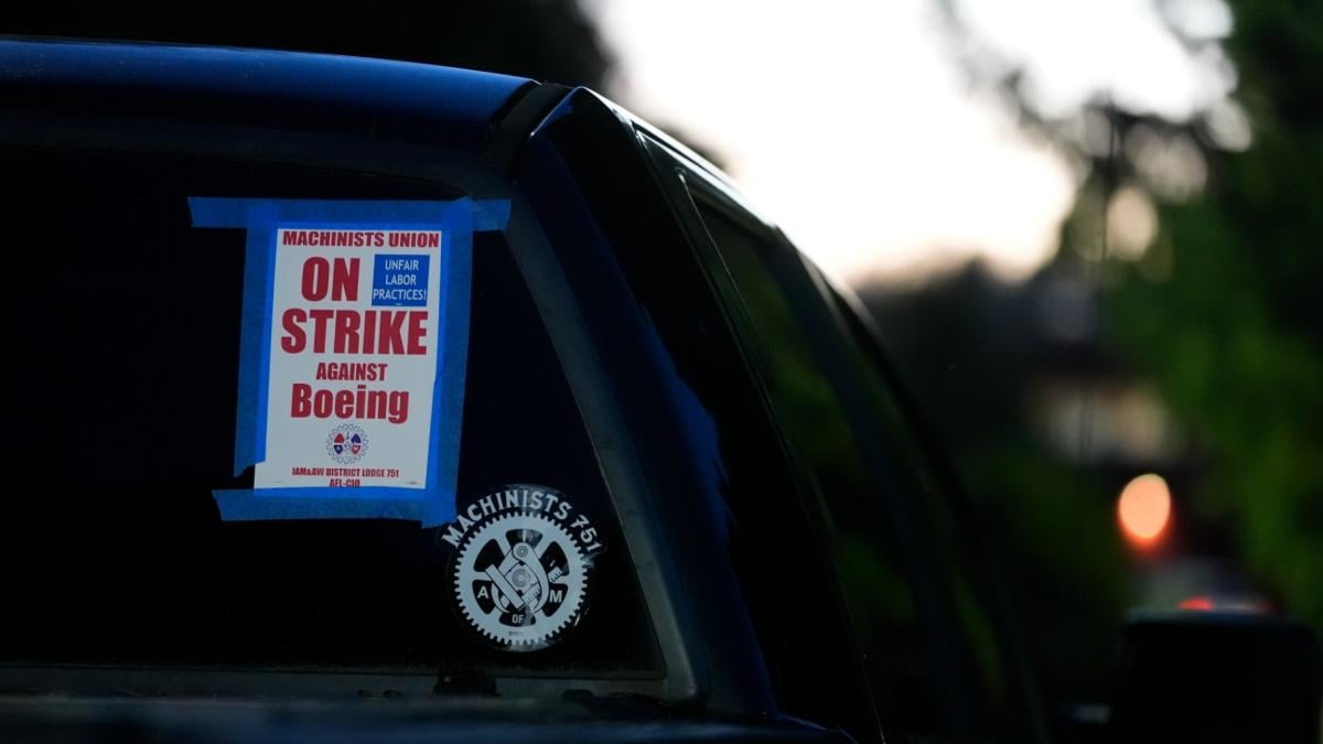 A truck displays a small strike sign in the parking lot of the Aerospace Machinists Union hall as Boeing employees arrive to vote on a new contract offer from the company, Nov. 4, 2024, in Renton, Wash. (AP Photo / Lindsey Wasson, file)