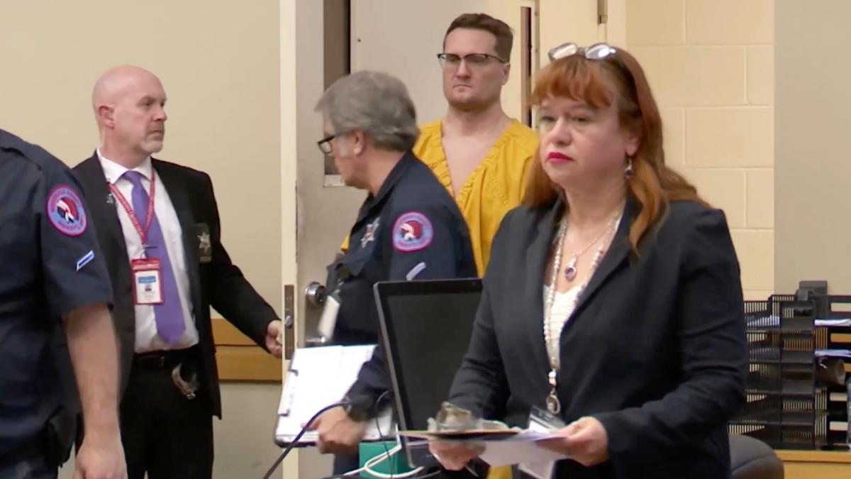 This image taken from video shows Michael David McKee walking into the courtroom on Monday, Jan. 12, 2026, in Rockford, Ill. (WIFR News / Pool Photo via AP)