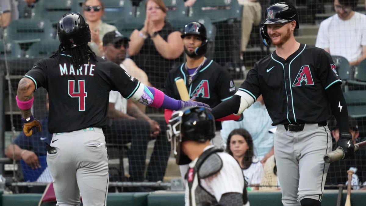 Arizona Diamondbacks' Ketel Marte (4) celebrates with Pavin Smith after hitting a solo home run during the first inning of a baseball game against the Chicago White Sox in Chicago, Tuesday, June 24, 2025. (AP Photo / Nam Y. Huh)