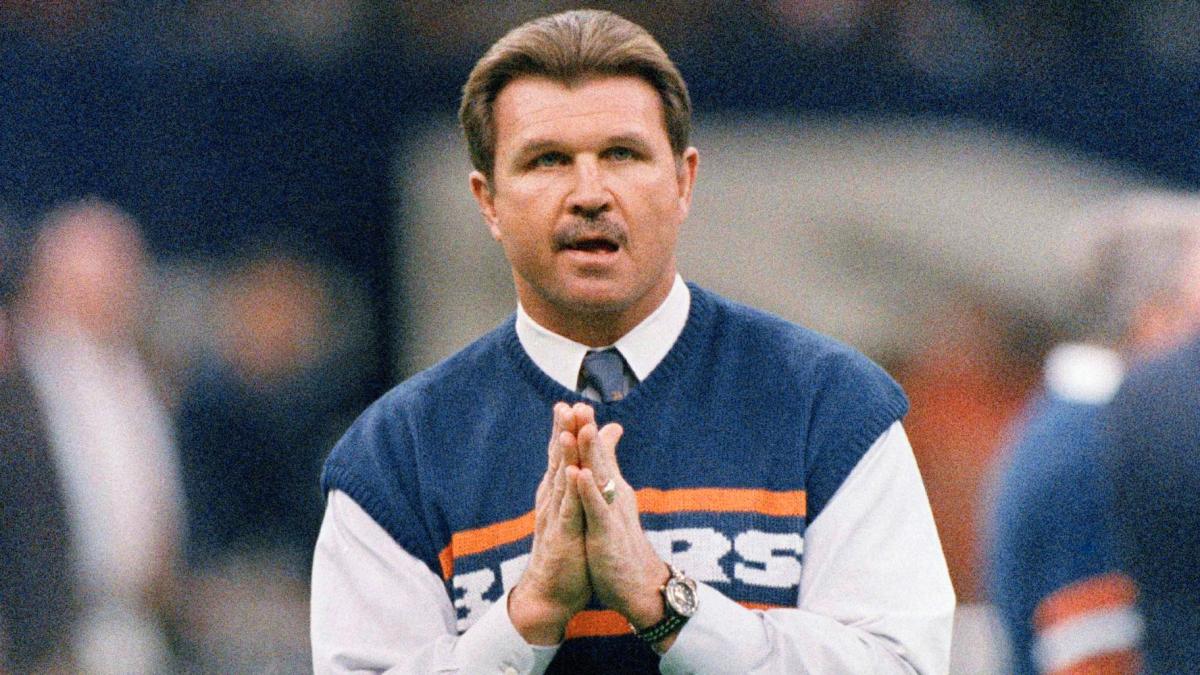 FILE - Chicago Bears head coach Mike Ditka strikes a prayerful pose as he watches the team workout, Jan. 26, 1986 in New Orleans before the start of NFL football's Super Bowl XX. (AP Photo / Rob Kozloff, File)